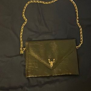 Alligator skin black purse with gold hardware